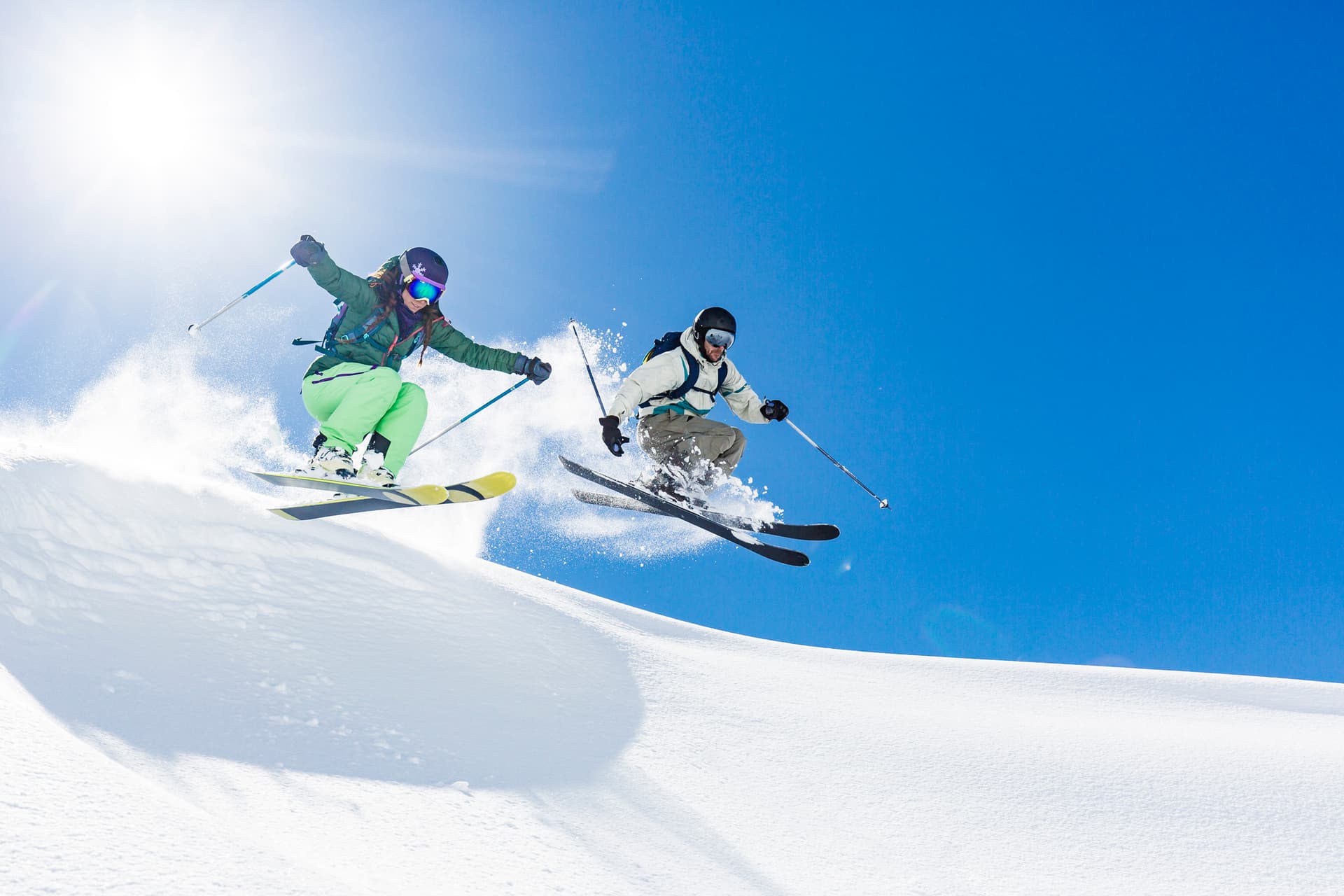skiers-man-and-woman-jumping